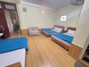 Postel nebo postele na pokoji v ubytování Hân Hoan Hotel