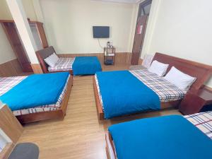 Postel nebo postele na pokoji v ubytování Hân Hoan Hotel