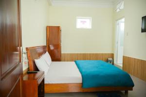 Postel nebo postele na pokoji v ubytování Hân Hoan Hotel