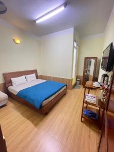 Postel nebo postele na pokoji v ubytování Hân Hoan Hotel