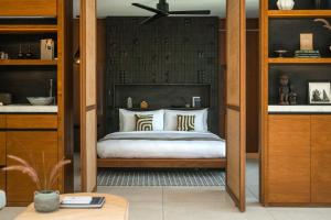 a bedroom with a bed in a room at Cap Karoso Sumba - a member of Design Hotels 