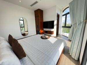 Postel nebo postele na pokoji v ubytování Thành Công Hotel