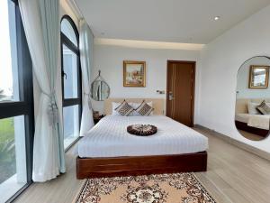 Postel nebo postele na pokoji v ubytování Thành Công Hotel