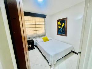Llit o llits en una habitació de Hermoso apartamento en la Floresta - Medellin