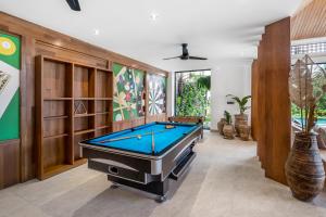 a billiard room with a pool table in it at Villa Pearl by BaliSuperHost in Ubud