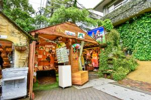 a small shed with a refrigerator in front of it at ＹＵＦＵＩＮ　ＦＬＯＲＡＬ　ＶＩＬＬＡＧＥ　ＨＯＴＥＬ in Yufu