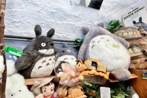 a pile of stuffed animals sitting on a shelf at ＹＵＦＵＩＮ　ＦＬＯＲＡＬ　ＶＩＬＬＡＧＥ　ＨＯＴＥＬ in Yufuin