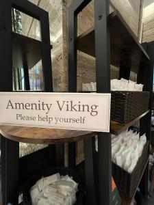 a sign that saysancy viking on a shelf with towels at KOKO HOTEL Premier Kanazawa Korinbo in Kanazawa