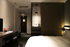 Postelja oz. postelje v sobi nastanitve Wonstar Hotel