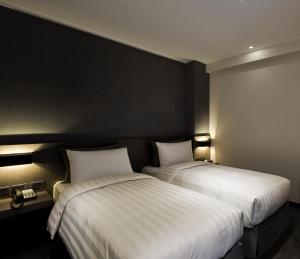 Postelja oz. postelje v sobi nastanitve Wonstar Hotel