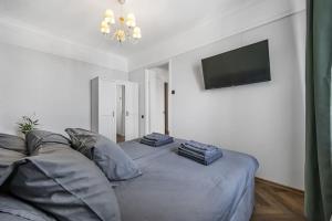 Postel nebo postele na pokoji v ubytování Cozy apartment in the city center