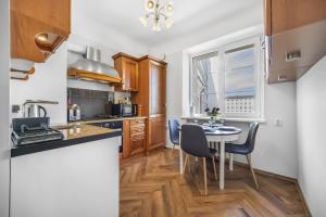 Kuchyň nebo kuchyňský kout v ubytování Cozy apartment in the city center