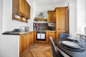 Kuchyň nebo kuchyňský kout v ubytování Cozy apartment in the city center