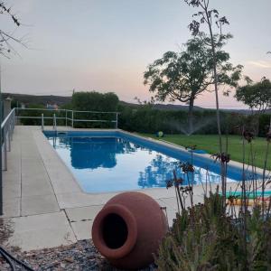 a swimming pool in a yard with at Casa Monte da Eira in Giões