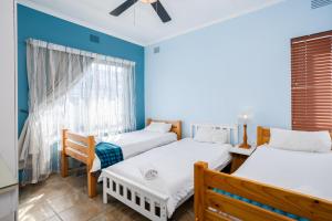 a bedroom with two beds and a window at Breathtaking views from Sue Casa 11 in Margate