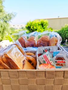 a basket filled with bread and pastries and other foods at La Penisola in Santa Maria La Carità
