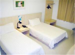 Llit o llits en una habitació de Jinjiang Inn - Shanghai Nanxiang