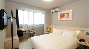 Llit o llits en una habitació de Jinjiang Inn - Shanghai Nanxiang