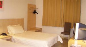 Llit o llits en una habitació de Jinjiang Inn - Shanghai Nanxiang