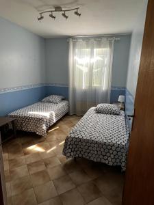 Un ou plusieurs lits dans un hébergement de l'établissement Villa la Montée