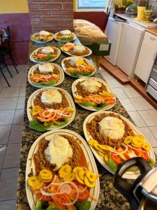 a table with many plates of food on it at Spa Rural Mirador de Miranda in Cutiellos