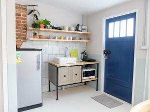 Kuchyň nebo kuchyňský kout v ubytování Snoozy Guesthouse