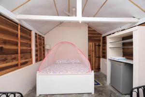 a bedroom with a bed in a room at The Tasty Tuna Cabana in Arugam Bay