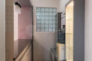 a kitchen with a window and a counter top at Asri Residence near Jalan Iskandar Muda Medan RedPartner in Medan