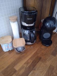 a blender sitting on top of a wooden floor at Calma in Perdika