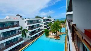 Výhled na bazén z ubytování Beachfront Apartment with Balcony, Sea View & Pool View - Cha Am - Hua Hin nebo okolí