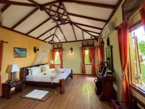 a bedroom with a bed in a room at La Digue Holiday Villa in La Digue +49 photos