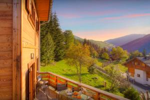 a balcony with a view of a mountain at Chalet Zamaro - OVO Network - OVO Network in La Clusaz
