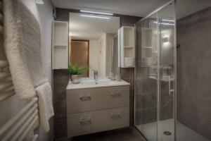 a bathroom with a sink and a shower at Chalet Zamaro - OVO Network - OVO Network in La Clusaz +36 photos
