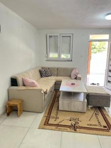 a living room with a couch and a table at Kuca za odmor Dejo in Krupa na Vrbasu