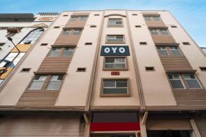 a building with the oxo sign on it at Hotel Aroma Classic Near Nampally Main Railway station in Hyderabad