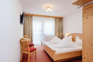 Postel nebo postele na pokoji v ubytování Hotel Andrea