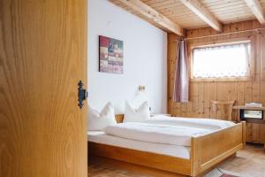 Postel nebo postele na pokoji v ubytování Hotel Andrea