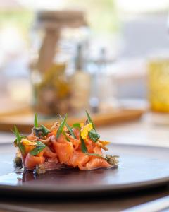 a plate of food sitting on a table at Landgut am Pößnitzberg in Leutschach