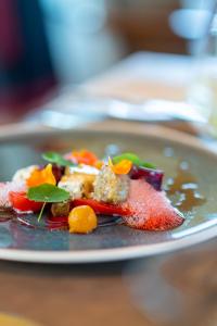 a plate of food on a table at Landgut am Pößnitzberg in Leutschach