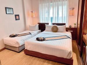 Rúm í herbergi á Elite Central Hotel Hanoi