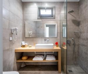 a bathroom with a sink and a shower at Blue View Villas in Stalís