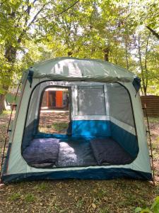 a tent that is sitting in the grass at Stoke Travel's Amsterdam Camping in Amsterdam