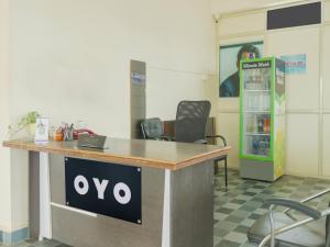 a xo sign on a desk in an office at Hotel O Sea Coastal Inn in Kākināda