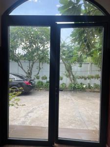 an open door with a view of a parking lot at Phụng Kim Thảo Hotel Long An in Long An