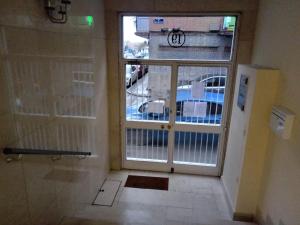 een kamer met een deur en uitzicht op een gebouw bij Room in Guest room - H Individual In Reformed Residence has wifi center num307 in Madrid