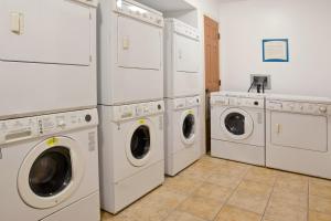 a laundry room with white washers and dryers at Staybridge Suites Columbus-Dublin, an IHG Hotel in Dublin