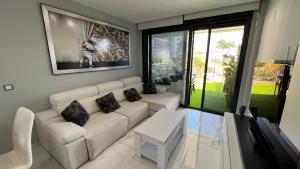 A seating area at Infinity View ( Arenales del Sol )