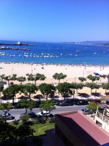 a view of a beach with boats in the water at Charming Apartment in Palamós with Sea View and Terrace - 65 sqm in Palamós