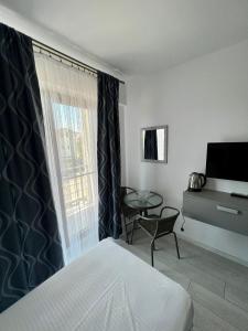 TV a/nebo společenská místnost v ubytování Luxury by SARAY