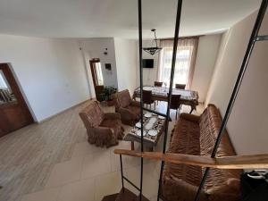 a living room with couches and a table at Fazenda B&B in Norashen